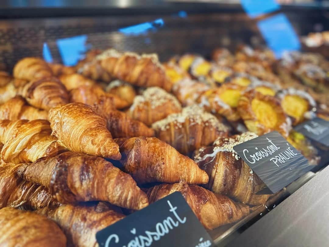Fresh golden croissants at Karameli